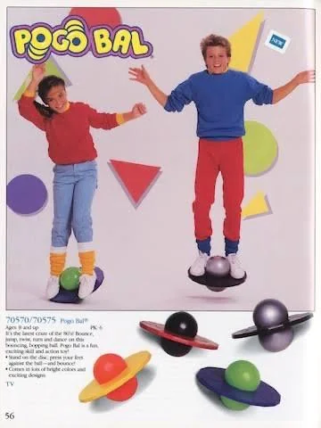 Two children, one in a red sweater and blue pants, the other in a blue sweater and red pants, are jumping on colorful Pogo Balls. The background features vibrant geometric shapes. Text above reads "Pogo Bal.