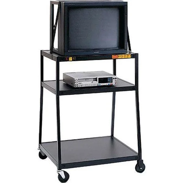 A vintage black TV cart with a large CRT television on top, a VHS player on the middle shelf, and an empty bottom shelf. The cart has four wheels for mobility.