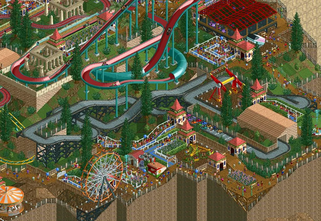 A vibrant theme park scene from RollerCoaster Tycoon features a water slide, roller coaster, Ferris wheel, and various rides surrounded by trees and visitors. The park is built on a cliff edge with pathways connecting attractions.