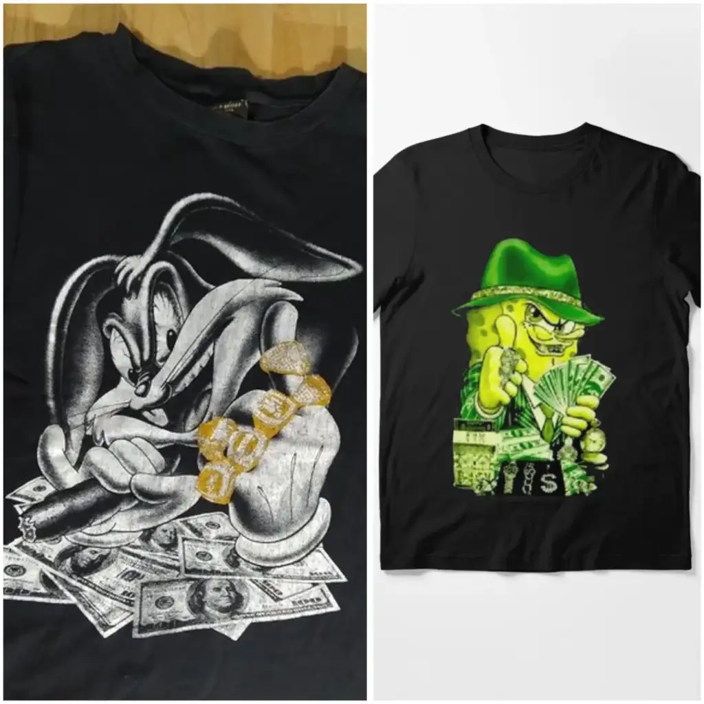 Two black t-shirts: the left features a cartoon rabbit with flashy rings holding cash, and the right shows a cartoon character in a green hat holding money. Both designs include dollar bills and a playful, extravagant theme.