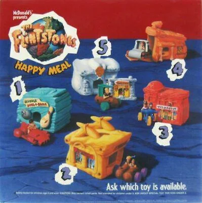 McDonald's Flintstones Happy Meal advertisement featuring five collectible toy cars: a dinosaur bus, a foot-powered car, a dino ride, a stone cabin vehicle, and a stone hut on wheels. Each toy is numbered and vibrantly colored.