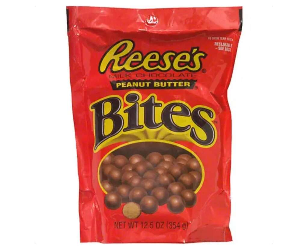 A red bag of Reese's Peanut Butter Bites is shown. The bag is labeled "Milk Chocolate" and weighs 12.5 oz (354 g). The image displays chocolate-covered bite-sized treats inside the bag.