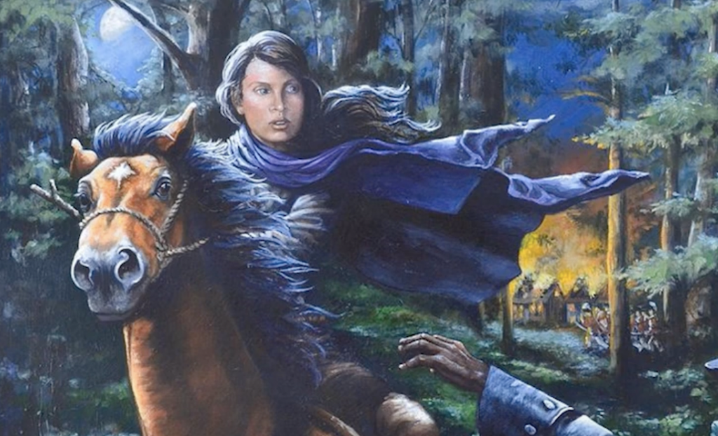 A person with long hair rides a horse through a forest at night, looking back with a determined expression. The horse's mane is windswept. A village in the background is on fire, casting an orange glow amidst the trees.