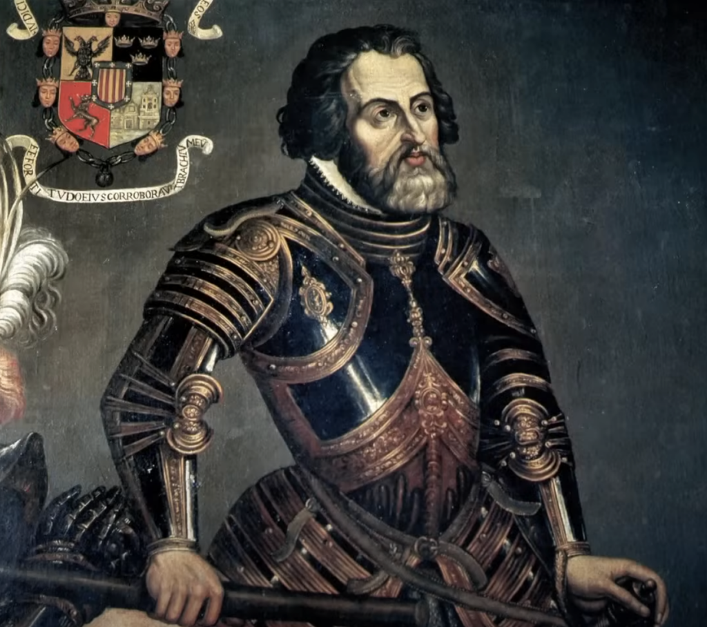 A historical painting of a man in ornate black and gold armor, standing with one arm resting on a helmet. He has a beard and mustache, and is gazing to the side. A detailed crest is visible in the top left corner of the image.