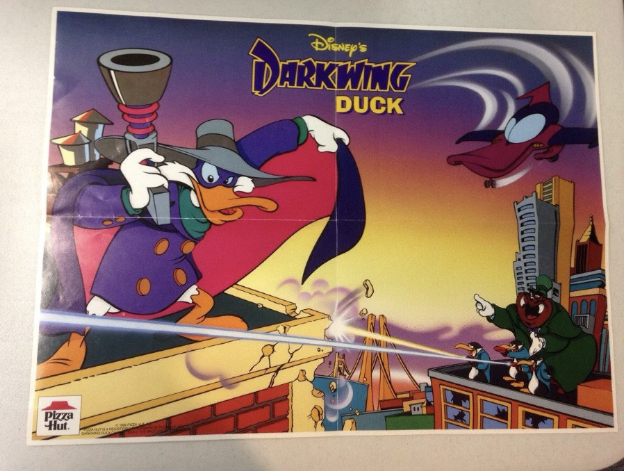 Promotional poster for Disney's "Darkwing Duck" featuring the main character in a purple outfit and hat, leaping dramatically. He is surrounded by city skyscrapers, and two other characters are engaging in action. A Pizza Hut logo is at the bottom.