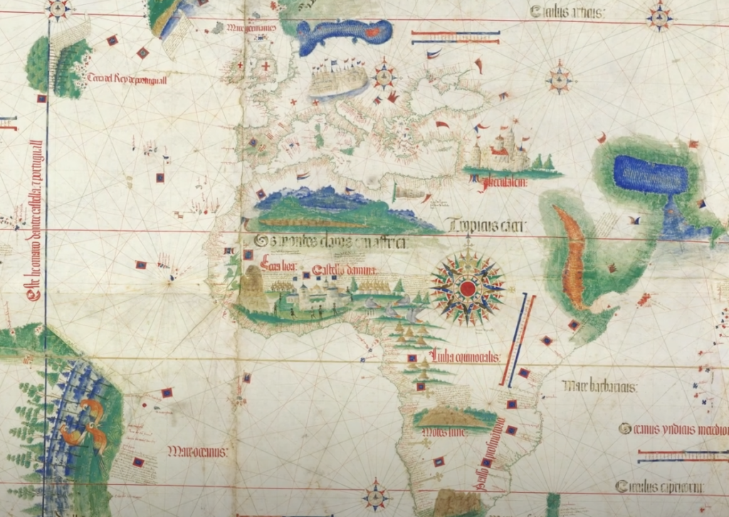 Antique nautical map showing Europe, Africa, and parts of the Americas. Illustrated in a vintage style with coastal outlines, compass roses, sea monsters, and medieval script. The map features intricate details and colored regions.