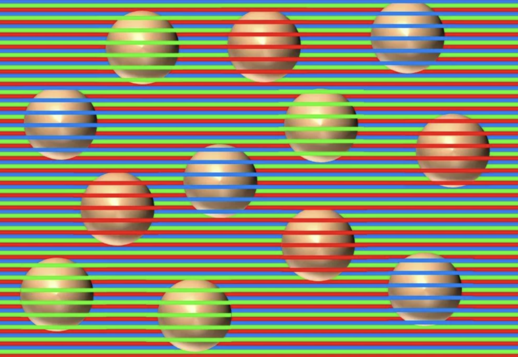 Optical illusion with spheres appearing to have horizontal stripes. The background is composed of horizontal green, red, and blue lines. The spheres are of varying colors, blending with the line patterns, creating a dynamic visual effect.