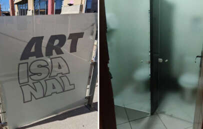 Split image: Left shows a glass gate with the bold text "ARTISANAL." Right shows a bathroom with two adjacent stalls; the frosted glass partially conceals toilets, providing minimal privacy.