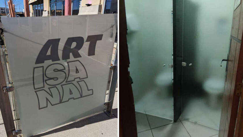 Split image: Left shows a glass gate with the bold text "ARTISANAL." Right shows a bathroom with two adjacent stalls; the frosted glass partially conceals toilets, providing minimal privacy.