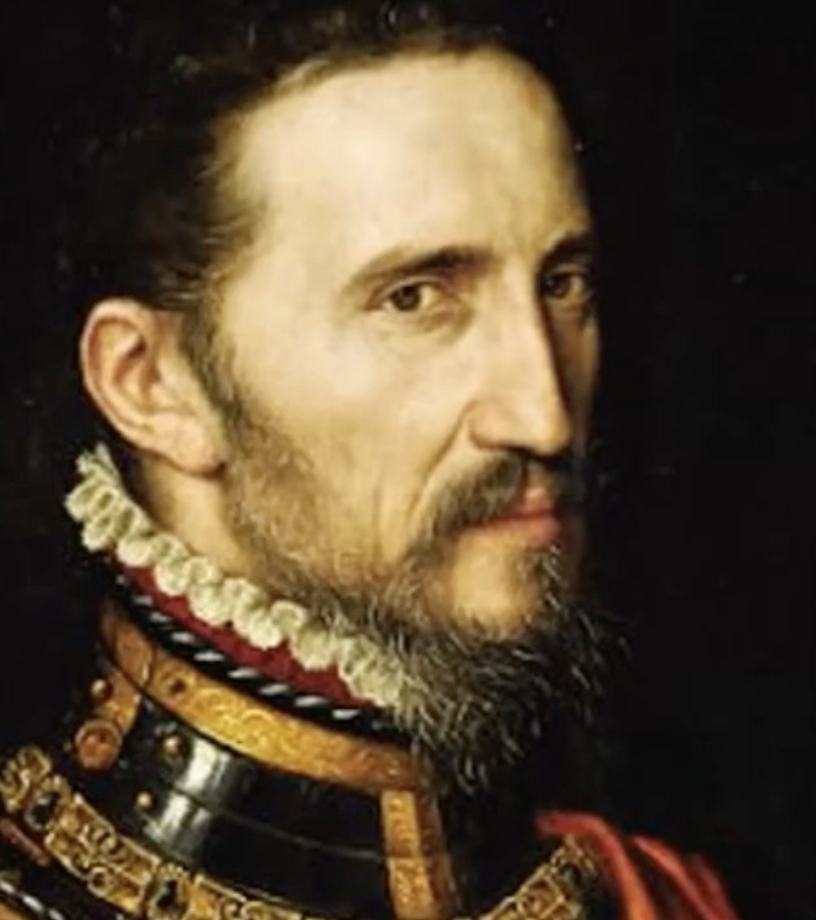 Painting of a man with a beard, wearing a ruffled collar and ornate armor with gold details. His head is turned slightly to the right, and he has a serious expression. The background is dark, highlighting his face and clothing.