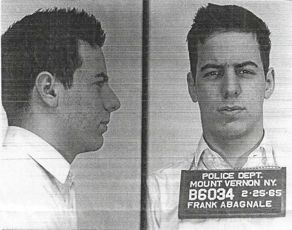 A split black and white mugshot shows a young man with short dark hair in a plain white shirt. The left side view is juxtaposed with a front view. A plaque reads "Police Dept. Mount Vernon N.Y., B6034, 2-25-65, Frank Abagnale.