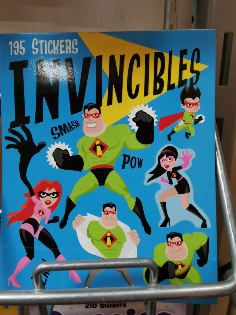 A colorful sticker sheet titled "Invincibles" features cartoon superheroes in various poses, including a green-suited strongman, a woman in red, and others with dynamic action words like "Smash" and "Pow.