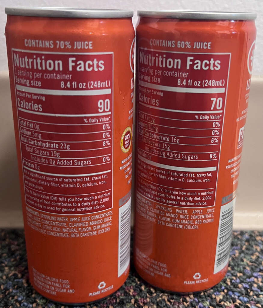 Two orange soda cans are displayed, showing their nutrition facts. The left can contains 70% juice and 90 calories per serving, while the right can has 60% juice and 70 calories. Both have details on sugar, sodium, and other nutritional values.