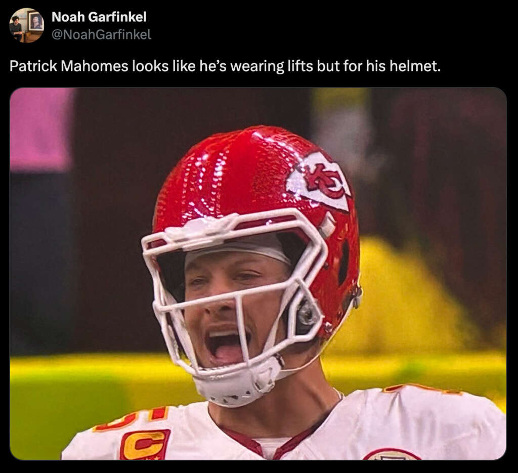 A football player wearing a red helmet with a white faceguard appears to be yelling on the field. The helmet looks disproportionately large on his head. There is text above him referencing lifts for the helmet.