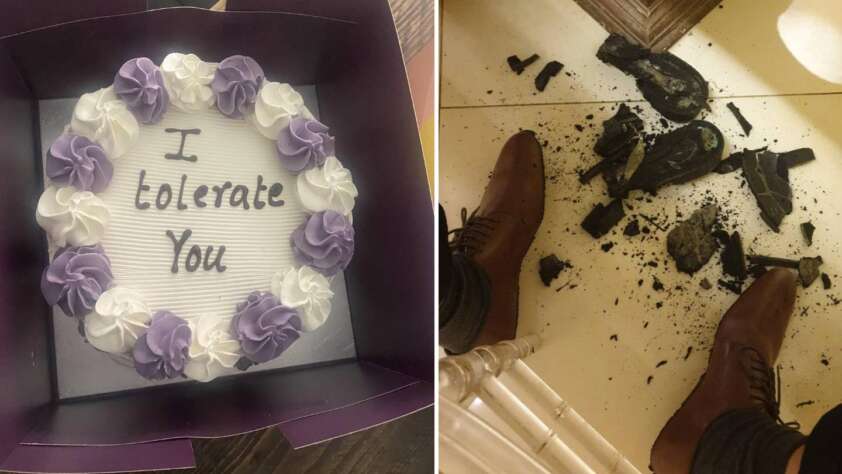 A cake with purple and white frosting reads "I tolerate you." Beside it, a separate image shows a pair of legs in brown shoes near a shattered black ceramic object on the floor.