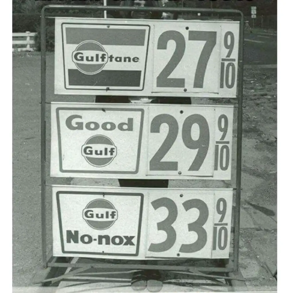 Vintage gas station sign displaying prices: Gulftane at 27 and 9/10 cents, Good Gulf at 29 and 9/10 cents, and Gulf No-nox at 33 and 9/10 cents.