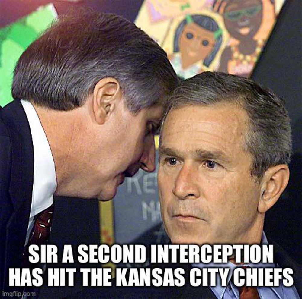 A man is whispering into the ear of another man who looks surprised. Text reads, "SIR A SECOND INTERCEPTION HAS HIT THE KANSAS CITY CHIEFS," resembling a famous historical context. A chalkboard is blurred in the background.