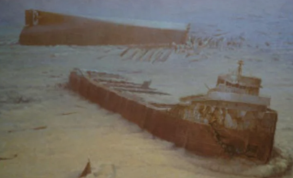 Underwater image of a sunken shipwreck, partially buried in sand. The ship appears corroded and broken into two main sections, with debris scattered around. The water is murky, adding a ghostly appearance to the scene.