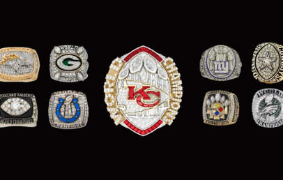 A collection of American football championship rings displayed against a black background. The centerpiece is a Kansas City Chiefs ring, surrounded by rings from various other teams, including the Packers, Raiders, Colts, Giants, Cowboys, Steelers, and Eagles.