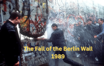 A group of people breaking through the Berlin Wall with a sledgehammer, surrounded by spray and graffiti. The text reads, "The Fall of the Berlin Wall 1989.