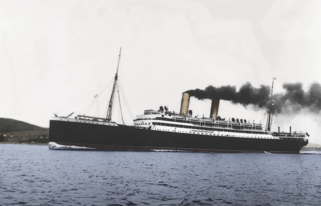 A vintage ocean liner with three smokestacks sails across calm waters, emitting black smoke. The ship's hull is dark with a white upper structure. A hilly coastline is visible in the background under a cloudy sky.