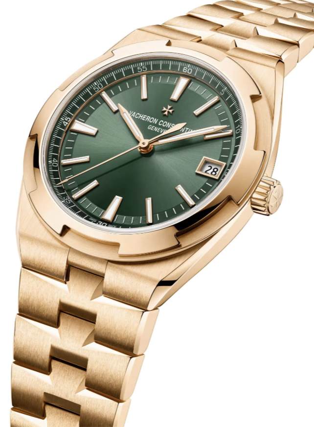 A luxurious gold wristwatch with a green dial, featuring gold hour markers and hands. It has a date display at the 3 o'clock position and a gold link bracelet. The watch epitomizes elegance and precision craftsmanship.