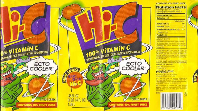 A colorful Hi-C juice box label featuring "Ecto Cooler" flavor with an animated green ghost holding an orange. The label states "100% Vitamin C" and includes nutrition facts. Vibrant yellow background with playful graphics and text.